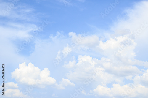 cloudscape with white clouds and blue sky