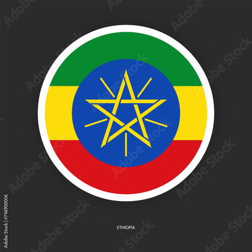 Ethiopia circle flag icon with white border isolated on dark grey background. Ethiopia circular flag icon on barely dark background.