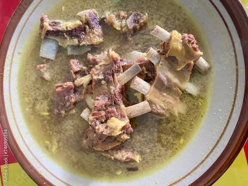 TENGKLENG Goat Curry or Lamb Curry is an authentic Indonesian meat stew, typically lamb. Gulai Kambing. Delicious Javanese Dish. photo