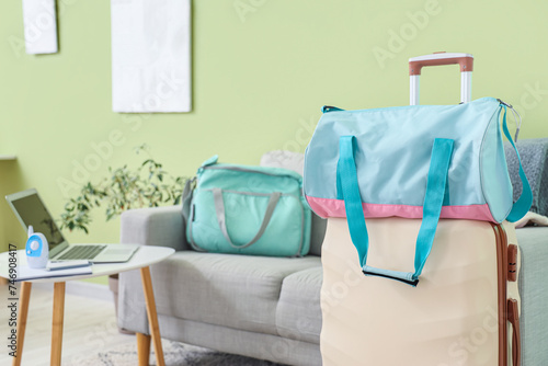 Maternity hospital bag on suitcase in living room