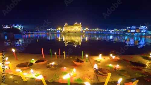Celebrate Gurupurab in Golden Temple and Fireworks, Fireworks adorn sky around Golden Temple on Guru Ramdas gurpurab photo