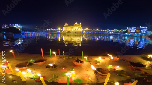 Celebrate Gurupurab in Golden Temple and Fireworks, Fireworks adorn sky around Golden Temple on Guru Ramdas gurpurab photo