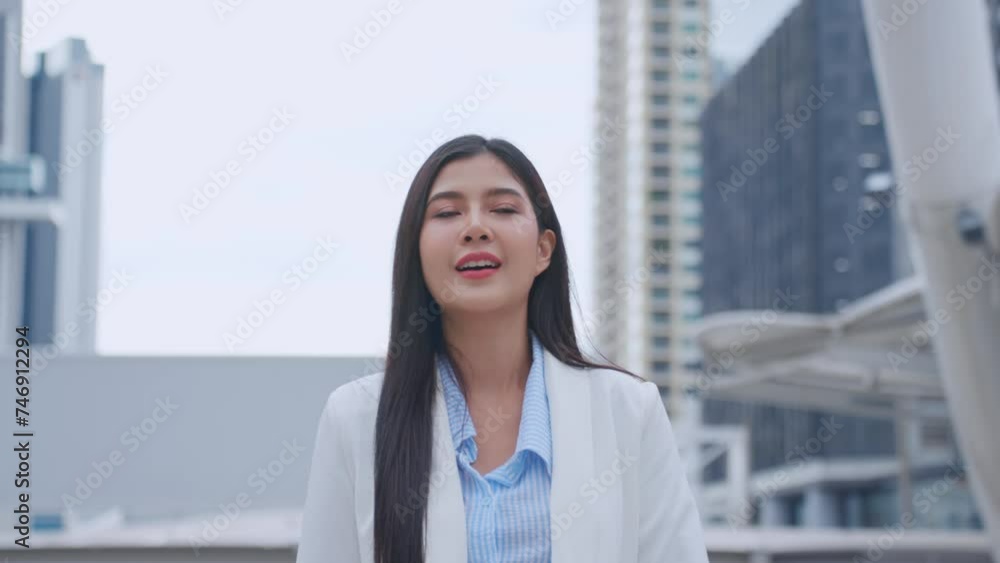 Asian youg beautiful businesswoman standing outdoor in modern city. Asian youg beautiful businesswoman standing outdoor in modern city.