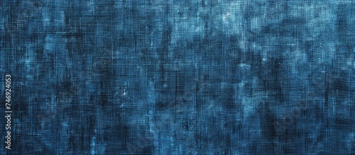 A seamless blue textured background featuring small squares in varying shades, resembling the natural hues of autumn and winter. The squares create a visually appealing geometric pattern on a rough