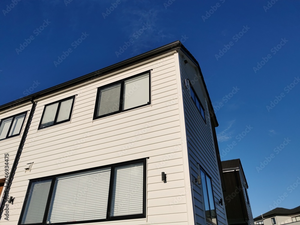 Modern townhouse with blue sky in background