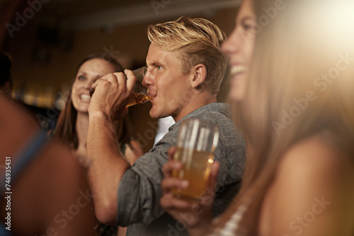 Friends, man and happiness in pub with beer for happy hour, relax or social event with window view. Diversity, people and drinking alcohol in restaurant or club with smile for bonding and celebration