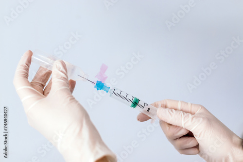 Принти на полотні hands with syringe injecting serum