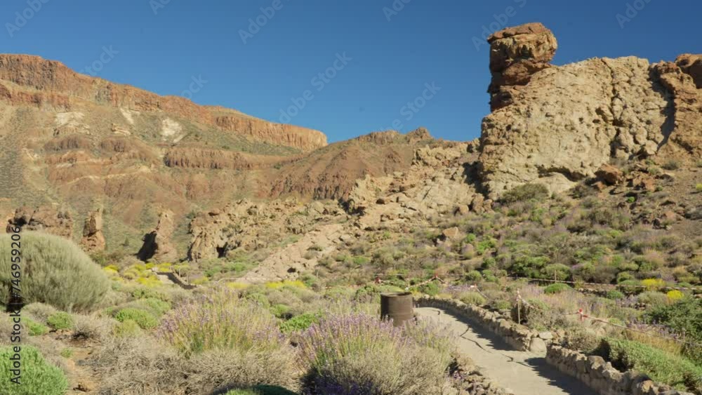 Panning view of Roques de Garcia in Teide national park, Tenerife, Spain Panning view of Roques de Garcia in Teide national park, Tenerife, Spain