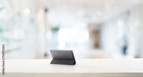 Empty White Working Table With Tablet Gadget photo