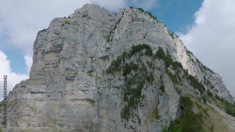 Tilt up to summit rock's mountain with clouds, Mount Granier, French Alps Tilt up to summit rock's mountain with clouds, Mount Granier, French Alps