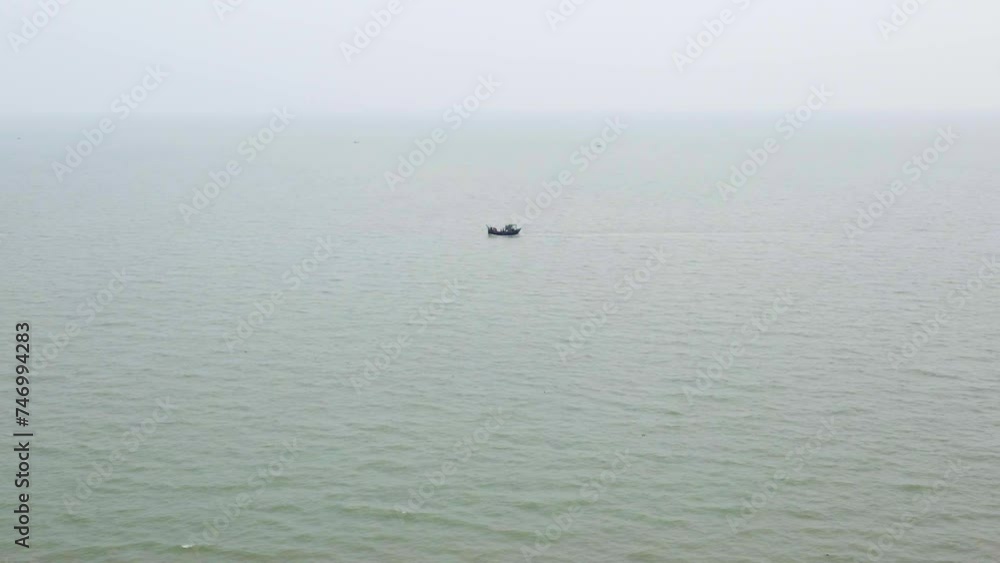 Solitary fishing trawler on the vast Indian Ocean Solitary fishing trawler on the vast Indian Ocean