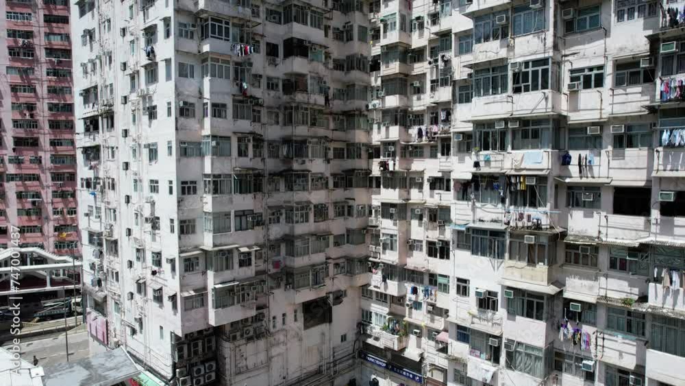 Monster building Montane Mansion in Quarry Bay Hong Kong, consists of several tightly packed buildings with window grilles, canopies, and air-conditioning ,an old residential units are well-proportion Monster building Montane Mansion in Quarry Bay Hong Kong, consists of several tightly packed buildings with window grilles, canopies, and air-conditioning ,an old residential units are well-proportion