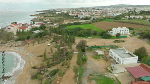 Aerial Flying Along Kapparis Neighborhood Coastline at Twilight Evening, Paralimni, Cyprus  photo