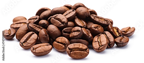 A collection of delicious coffee beans stacked on a plain white background, suitable for coffee enthusiasts and lovers of the aromatic beverage.