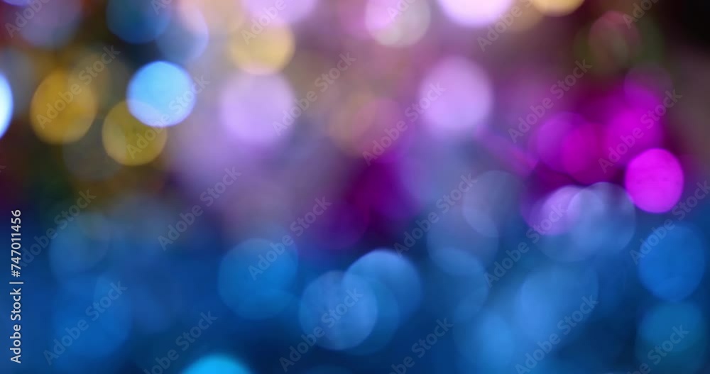 Abstract background with bokeh effect blurred defocused multicolored lights on dark background Abstract background with bokeh effect blurred defocused multicolored lights on dark background