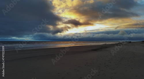 Colorful sunset on the shores of the Barents Sea. Varandey, Arctic, Russia.