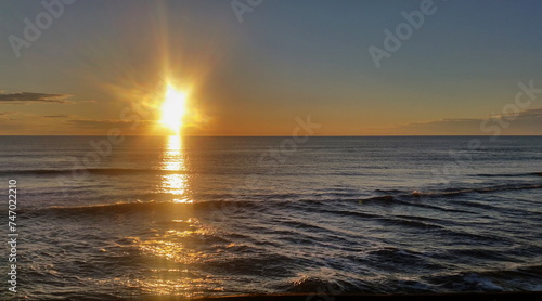Colorful sunset on the shores of the Barents Sea. Varandey, Arctic, Russia.