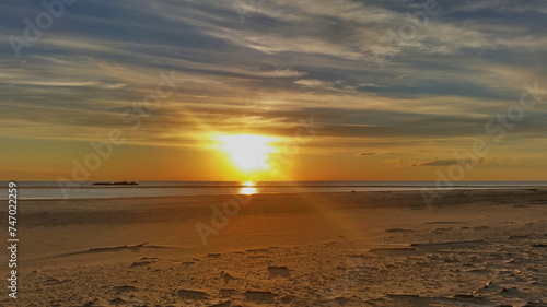 Colorful sunset on the shores of the Barents Sea. Varandey, Arctic, Russia.