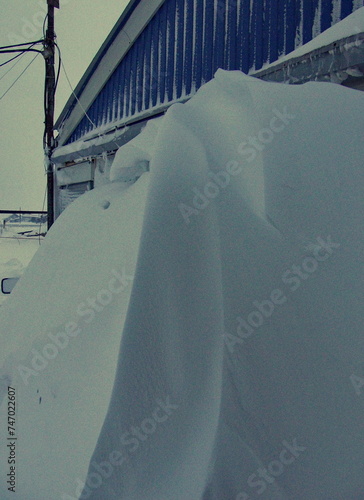 A large snowdrift the size of a building. Varandey, Arctic, Russia.