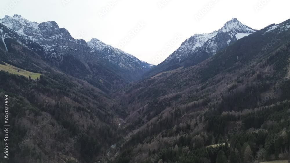 Aerial View of Mountain Landscape with Snow covered Mountains and Forest in winter, Austria, 4K 30 fps video Aerial View of Mountain Landscape with Snow covered Mountains and Forest in winter, Austria, 4K 30 fps video