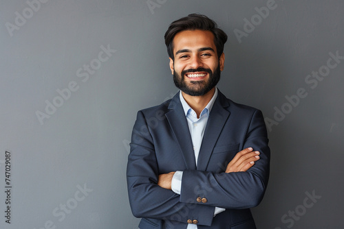 Smiling happy young indian business man photo