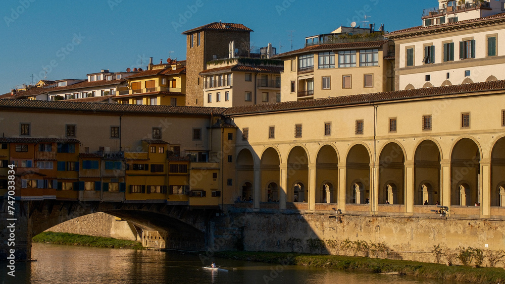 Golden Moments on Florence's Old Bridge: Sunset Stroll
