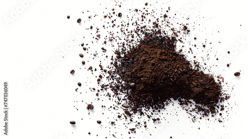 Soluble coffee is scattered on a white background.