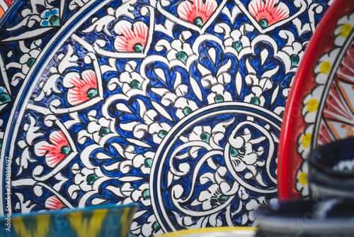 Multi-colored ceramic products with oriental ornaments at the Siab Bazaar in the ancient city of Samarkand in Uzbekistan, Siyob bozor photo