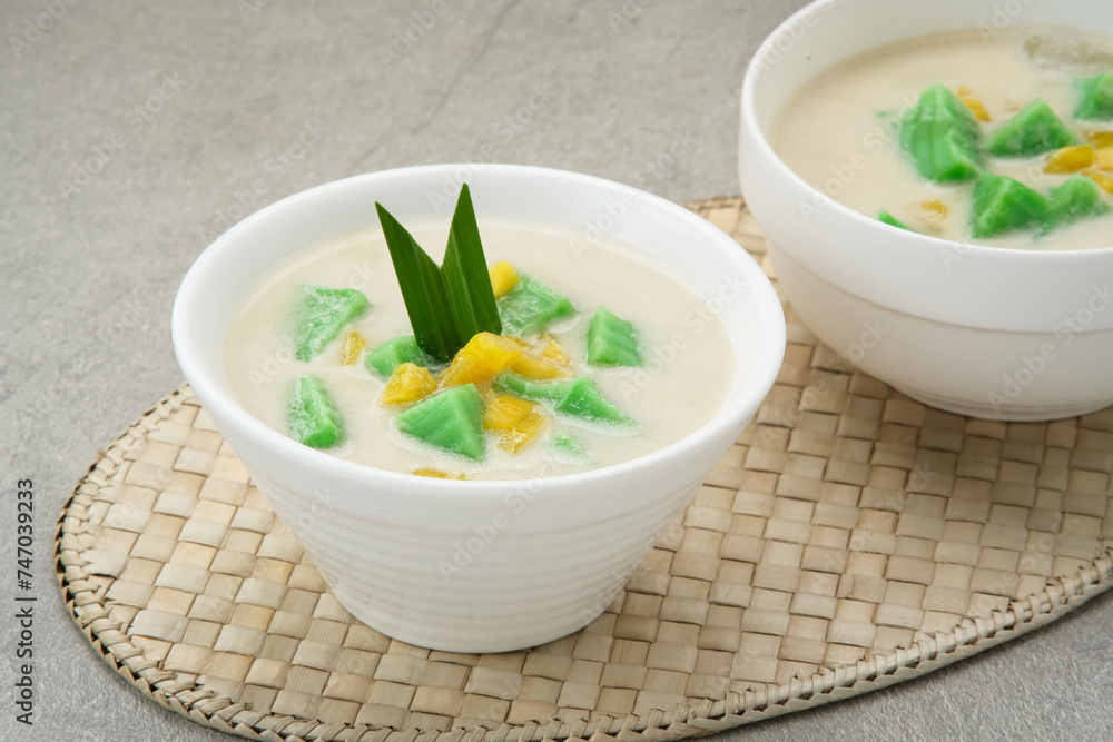 Es Bongko, traditional food made from hunkwe flour, pandan leaves, coconut milk. Indonesian food
Es Bongko, traditional food made from hunkwe flour, pandan leaves, coconut milk. Indonesian food