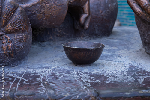 Bronze sculpture of bowl close up in Ichan qalʼa, Khiva, Uzbekistan photo