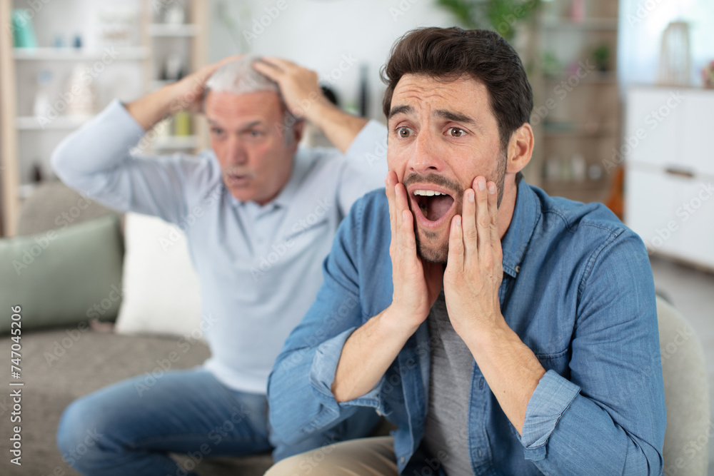 two generations of men frustrated by favourite football team failure two generations of men frustrated by favourite football team failure