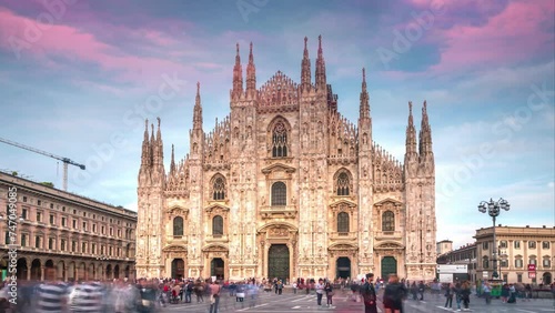 Milan Cathedral Hyperlapse Time lapse. People walking on Square Piazza Duomo di Milano and Gallery Vittorio Emanuele II, during the fashion week timelapse city in 4K. photo
