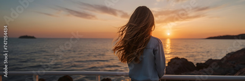 Serene Sunset Seascape: Rear View of a Young Girl. 3:1 landscape banner and background style. Space for text. Suitable for website headers or background, summer vacation, holiday destination.