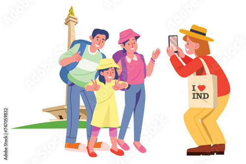 Family is Taking a Group Photograph in Front of the Monas Monument | Travel Summer Activity
