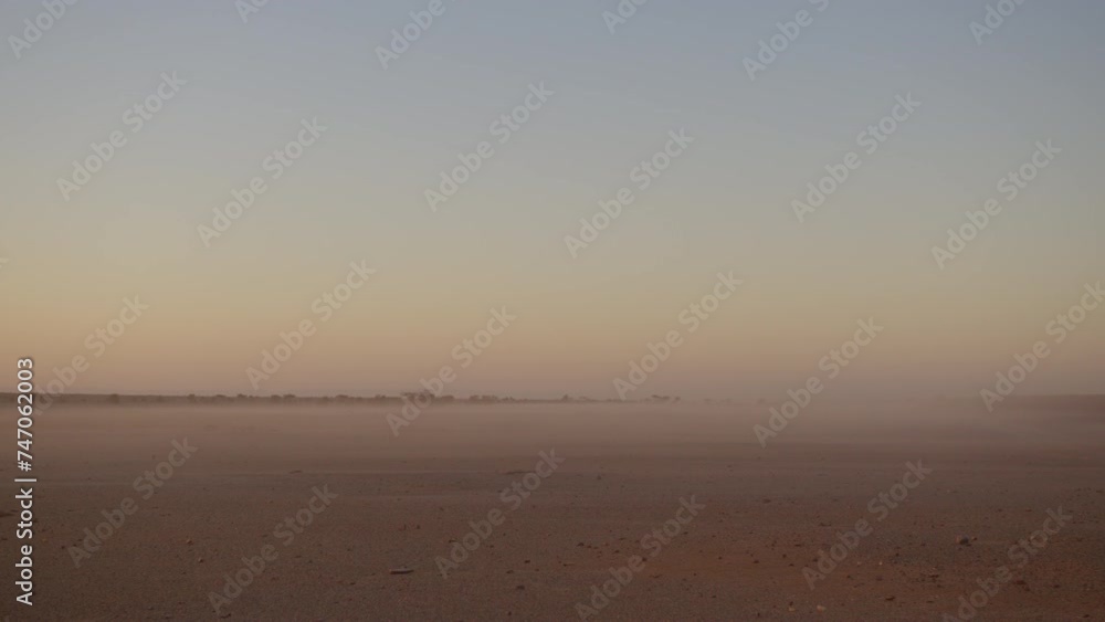 Dawn view into the desert in africa with fog Dawn view into the desert in africa with fog