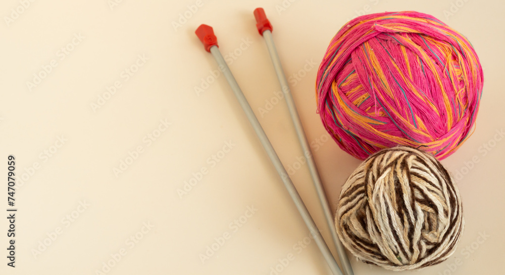 Red ball of thread, spokes, on a light-colored background