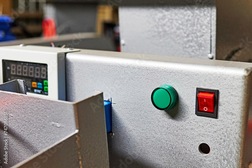 the power button and indicator light on the control panel of the equipment