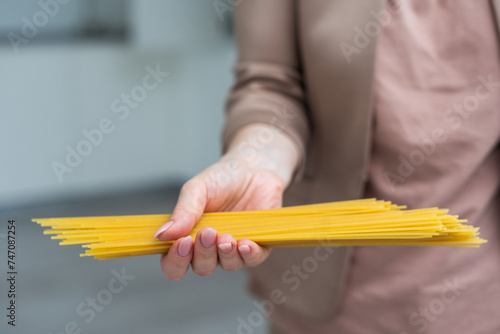 Spaghetti in hand on white