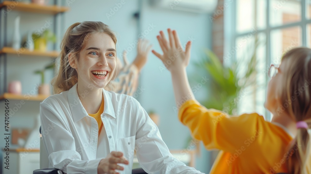 Smiling pediatrician giving high five to little girl at medical office, healthcare, positive environment Smiling pediatrician giving high five to little girl at medical office, healthcare, positive environment
