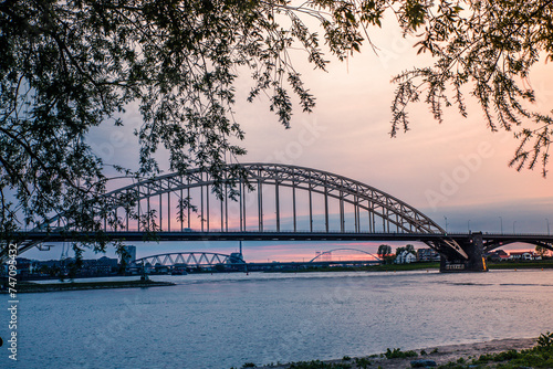 Waalbridge in Nijmegen, the Netherlands over the river Waal at sunset.