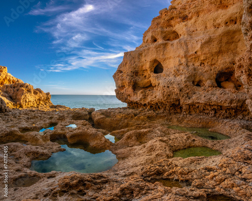 Sculptural rock formations, natural caves and tidal pools on the shores of the Atlantic ocean, Algar seco, Carvoeiro, Lagoa, Algarve, Portugal.