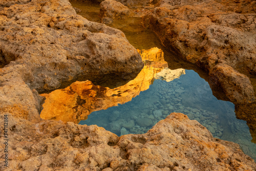 Tidal pool at the base of the stunning Algar seco cliffs, Carvoeiro, Lagoa, Algarve, Portugal.