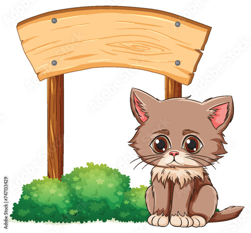 Adorable brown kitten sitting by a signpost