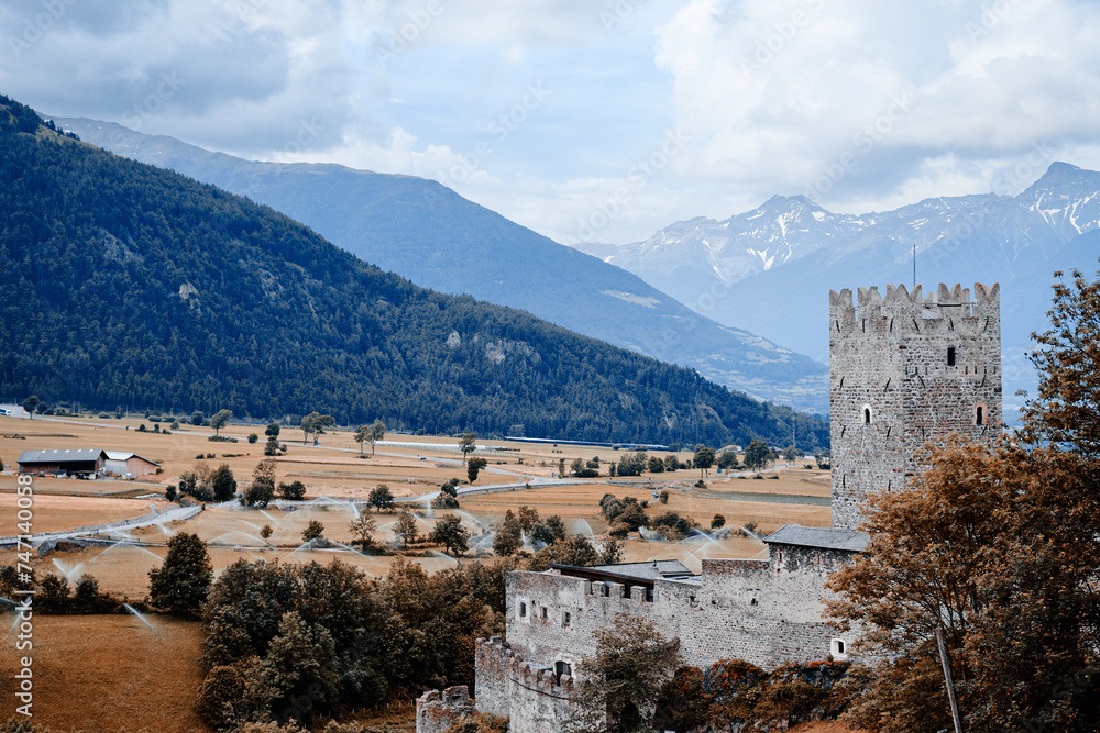Burgusio, South Tyrol, northern Italy. Marienberg Abbey and its castle dominate the landscape of Val Venosta. View from outside.