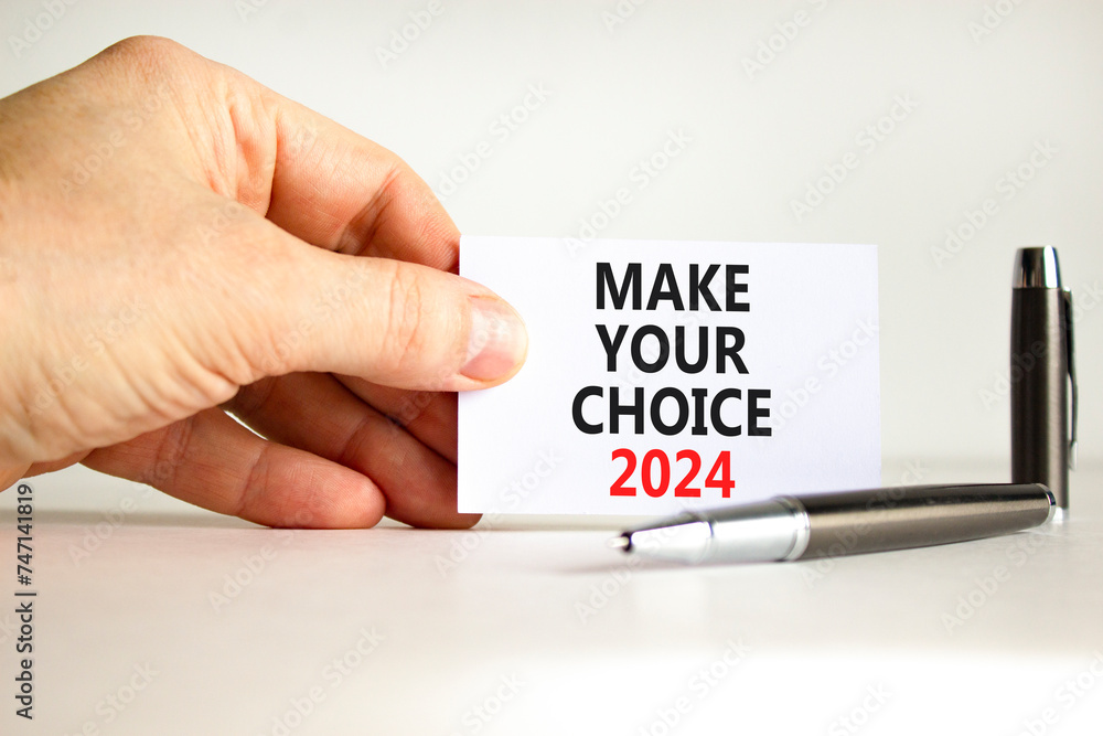 Make your choice 2024 symbol. Concept words Make your choice 2024 on beautiful white paper. Beautiful white background. Voter hand. Business Make your choice 2024 concept. Copy space Make your choice 2024 symbol. Concept words Make your choice 2024 on beautiful white paper. Beautiful white background. Voter hand. Business Make your choice 2024 concept. Copy space