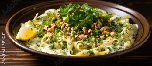 A wooden bowl filled to the brim with Turkish-style cheesy eriste, pasta, mixed vegetables, and garnished with walnuts and parsley. The vibrant colors of the vegetables contrast beautifully with the