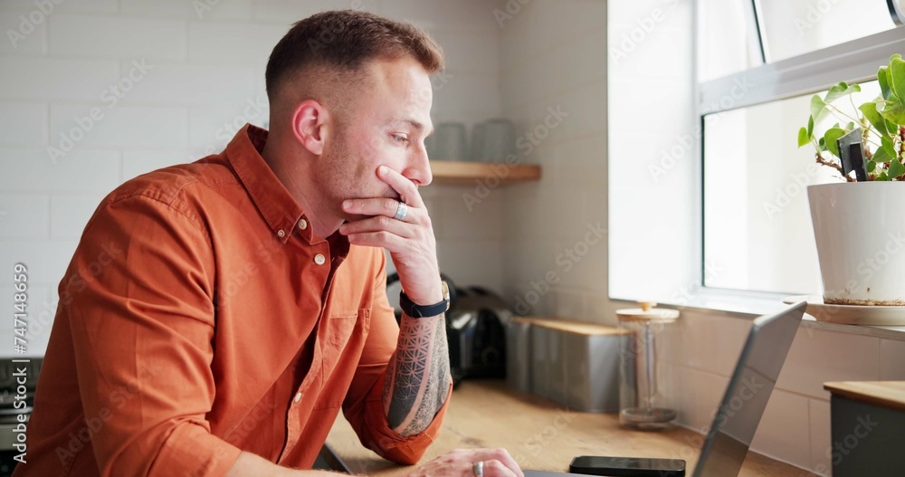 Man, thinking and typing on laptop at home, planning and reflection by kitchen window in apartment. Male person, freelancer and contemplating ideas or online research, website and remote work or job Man, thinking and typing on laptop at home, planning and reflection by kitchen window in apartment. Male person, freelancer and contemplating ideas or online research, website and remote work or job