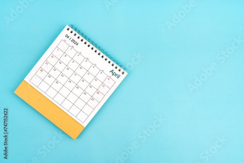 2024 April Desk Calendar On Blue Background.