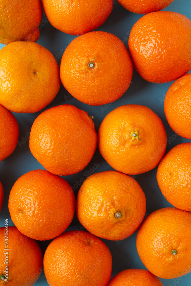Many fresh oranges top view. Vibrant vertical photo of citrus fruits flat lay background. Vitamin C Many fresh oranges top view. Vibrant vertical photo of citrus fruits flat lay background. Vitamin C