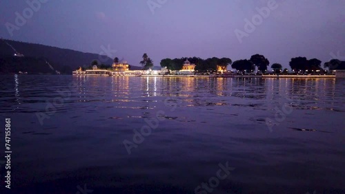 Udaipur, Rajasthan, India-October 30 2023; A Dramatic view of the Jag Mandir lake palace in the golden hours, a popular Wedding and travel destinations in Rajasthan, India.
